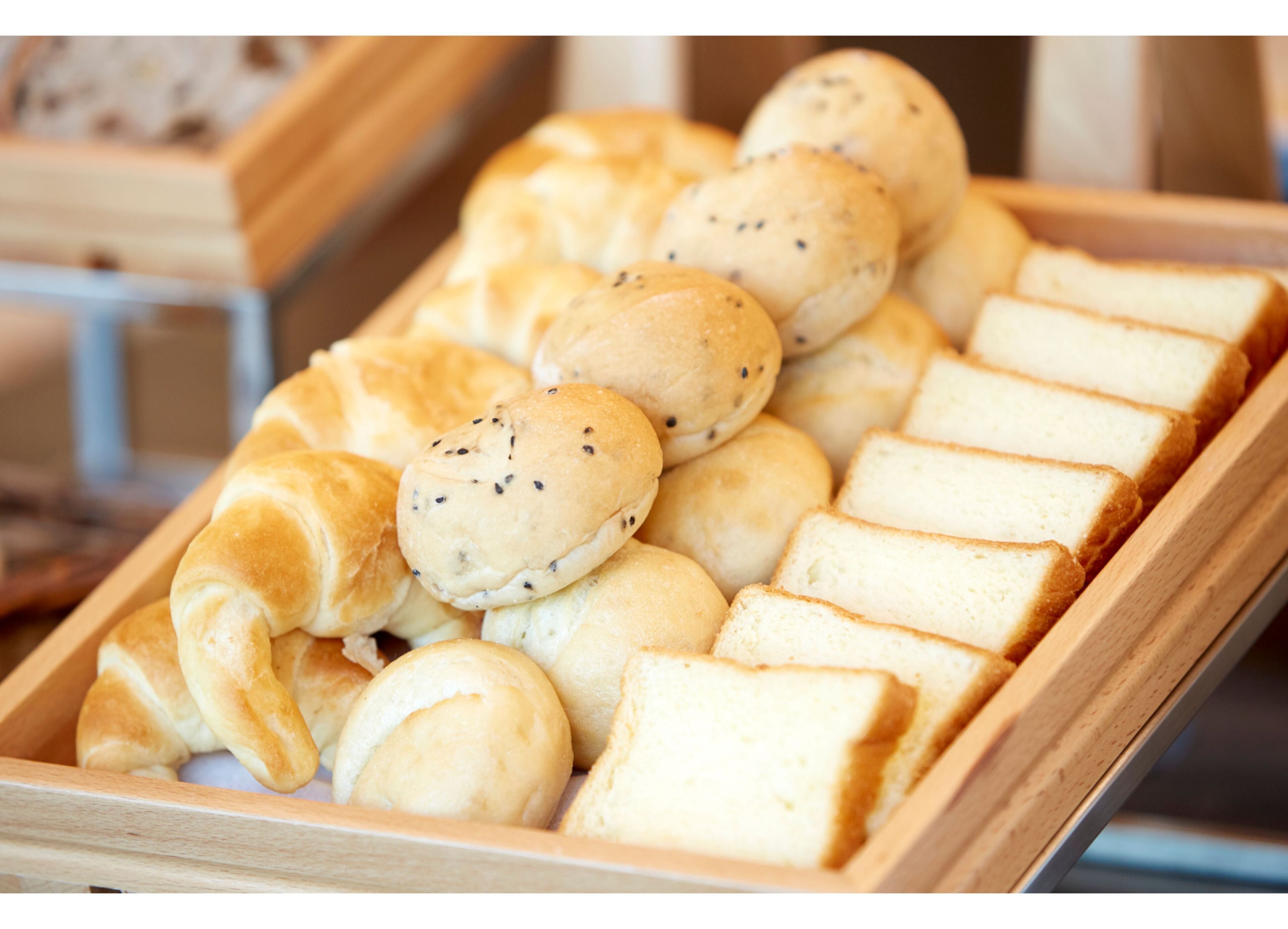 A tray of assorted bread rolls and slices.