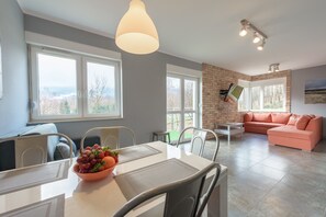 Apartamento conforto | Área de estar | TV de tela plana