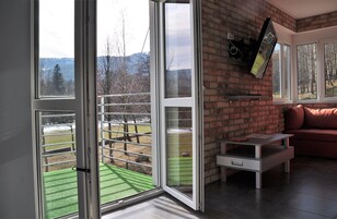 Comfort Apartment | Living area | Flat-screen TV