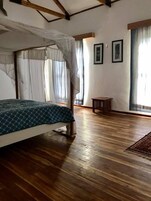 Desk, iron/ironing board, bed sheets