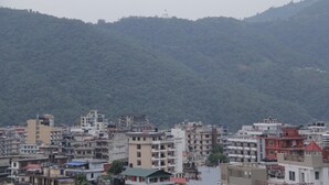A densely packed urban area with multi-story buildings, some with visible balconies and terraces. - Hotel Brothers Inn (Pokhara)