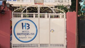 A gated entrance to Hotel Brothers Inn, featuring a prominent logo and a sign indicating the hotel's name. - Hotel Brothers Inn (Pokhara)