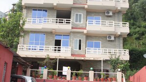 A multi-story building with balconies and a sign reading "BROTHER'S INN". - Hotel Brothers Inn (Pokhara)