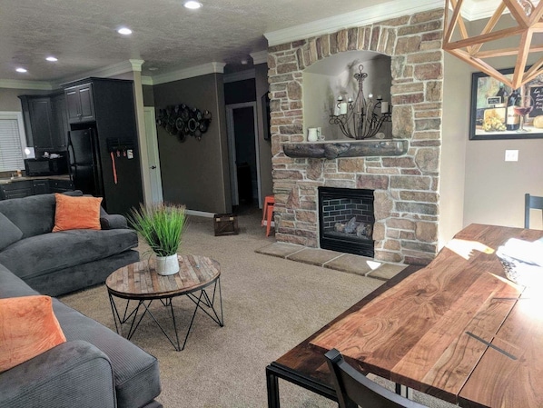 Smart TV, fireplace, table football, books