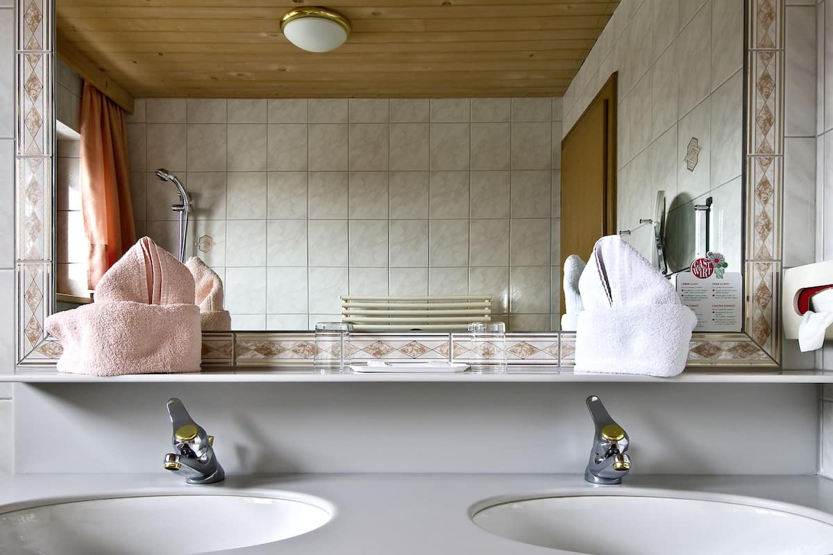 deluxe room | bathroom | hair dryer, bathrobes, slippers, towels