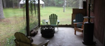 Cute cabin and pole building with bathroom facilities and kitchen area