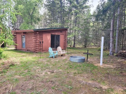 Cute cabin and pole building with bathroom facilities and kitchen area