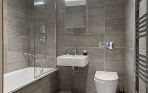 Apartment, 4 Bedrooms | Bathroom | Combined shower/tub, free toiletries, hair dryer, towels