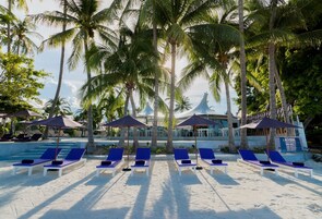 On the beach, sun loungers, beach umbrellas, beach towels