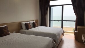 Deluxe Quadruple Room, Sea View | 1 bedroom, premium bedding, pillowtop beds, minibar - Galaxy Hotel (Quy Nhon)