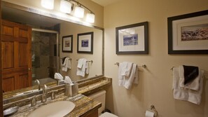 Combined shower/bathtub, hair dryer, towels, soap