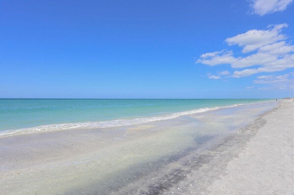 Enjoy a serene beach experience with a wide, well-maintained shoreline and a gentle slope into the calm waters.