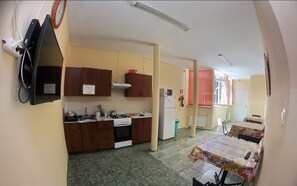 Economy Room | Shared kitchen facilities | Fridge, microwave, oven, cookware/dishes/utensils