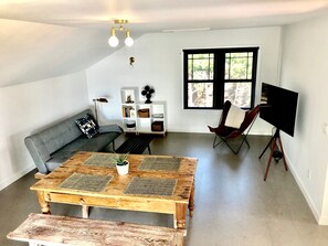 Smart TV, fireplace, books, printers