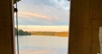 Newly built modern house solely located directly by the lake with its own dock and boat