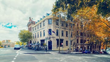A historic building with multiple signs including "Lord Nelson Hotel," "Lord Nelson Brewery," and "Lord Nelson Hotel."