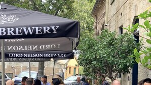 An outdoor seating area at Lord Nelson Brewery with patrons dining and drinking. - The Lord Nelson Brewery Hotel (Millers Point)