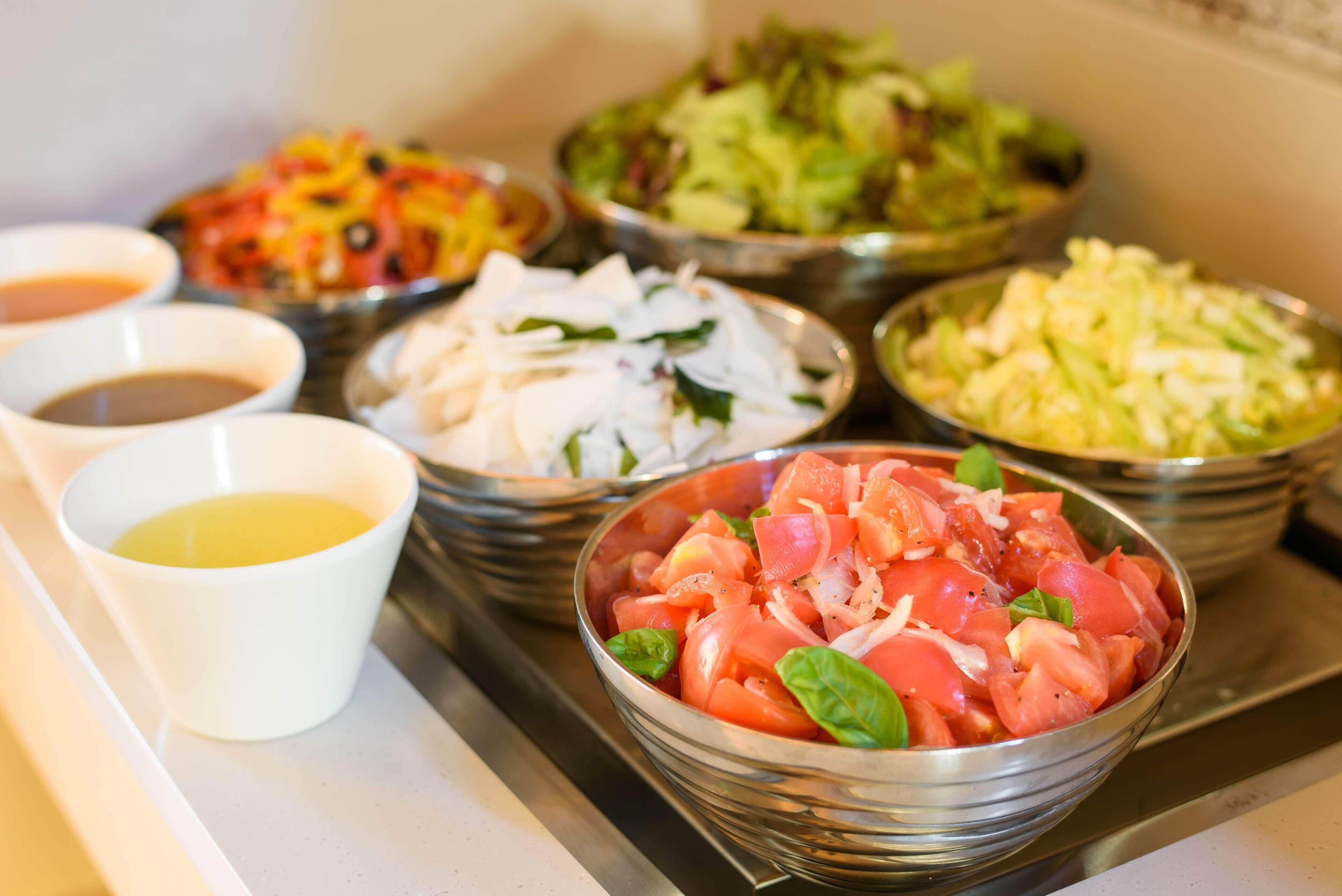A variety of food bowls on a kitchen counter.