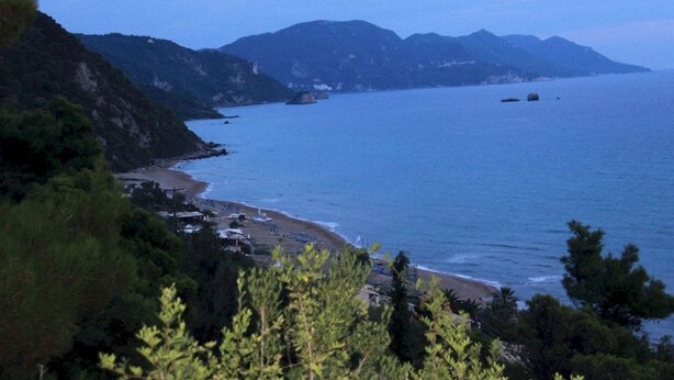 A coastal landscape with a beach, mountains, and a clear sky. - Corfu Island Apartment 149 (Corfu)