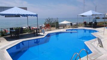 Seasonal outdoor pool, pool loungers