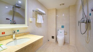 A modern bathroom with a sink, mirror, towel rack, toilet, and shower. - Sucha Hotel Xian Hangtiancheng Station (Xi'an)
