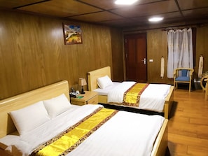 Standard Triple Garden View | Minibar, in-room safe, individually decorated, desk