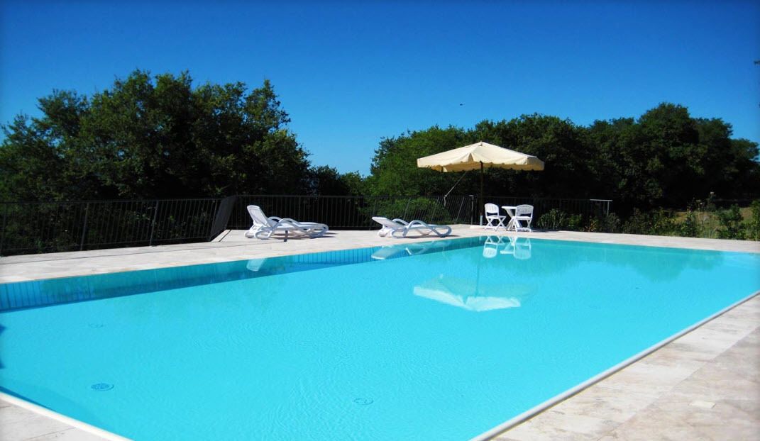 Seasonal outdoor pool, open 9:00 AM to 9:30 PM, pool umbrellas