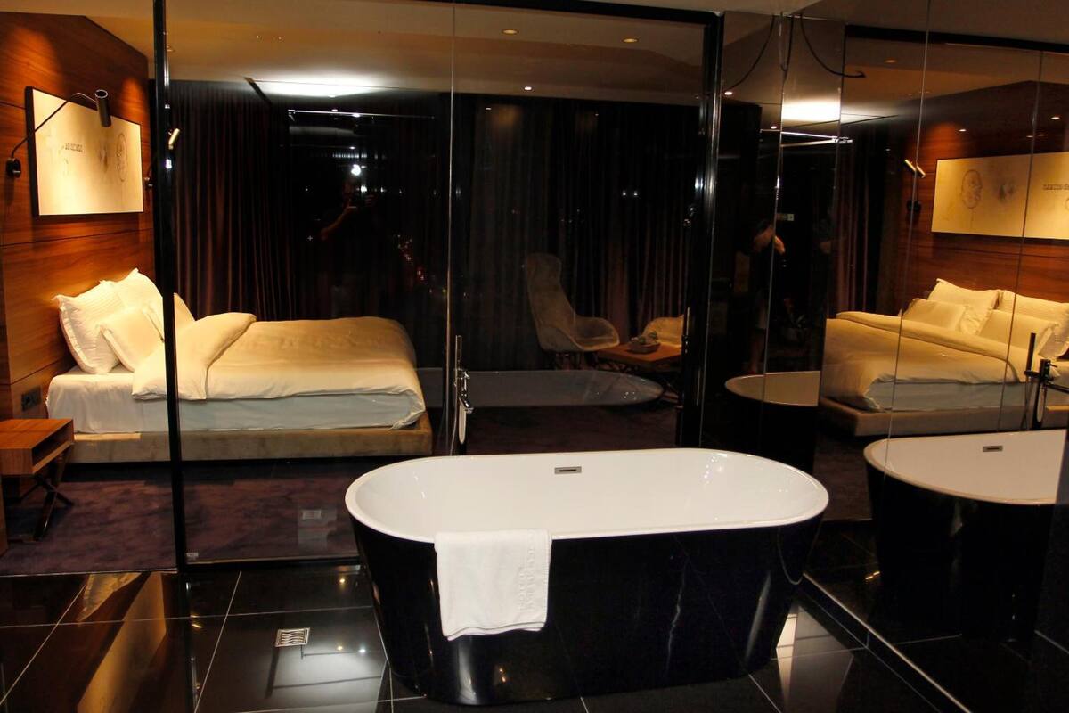 designer toiletries, hair dryer, bathrobes, slippers