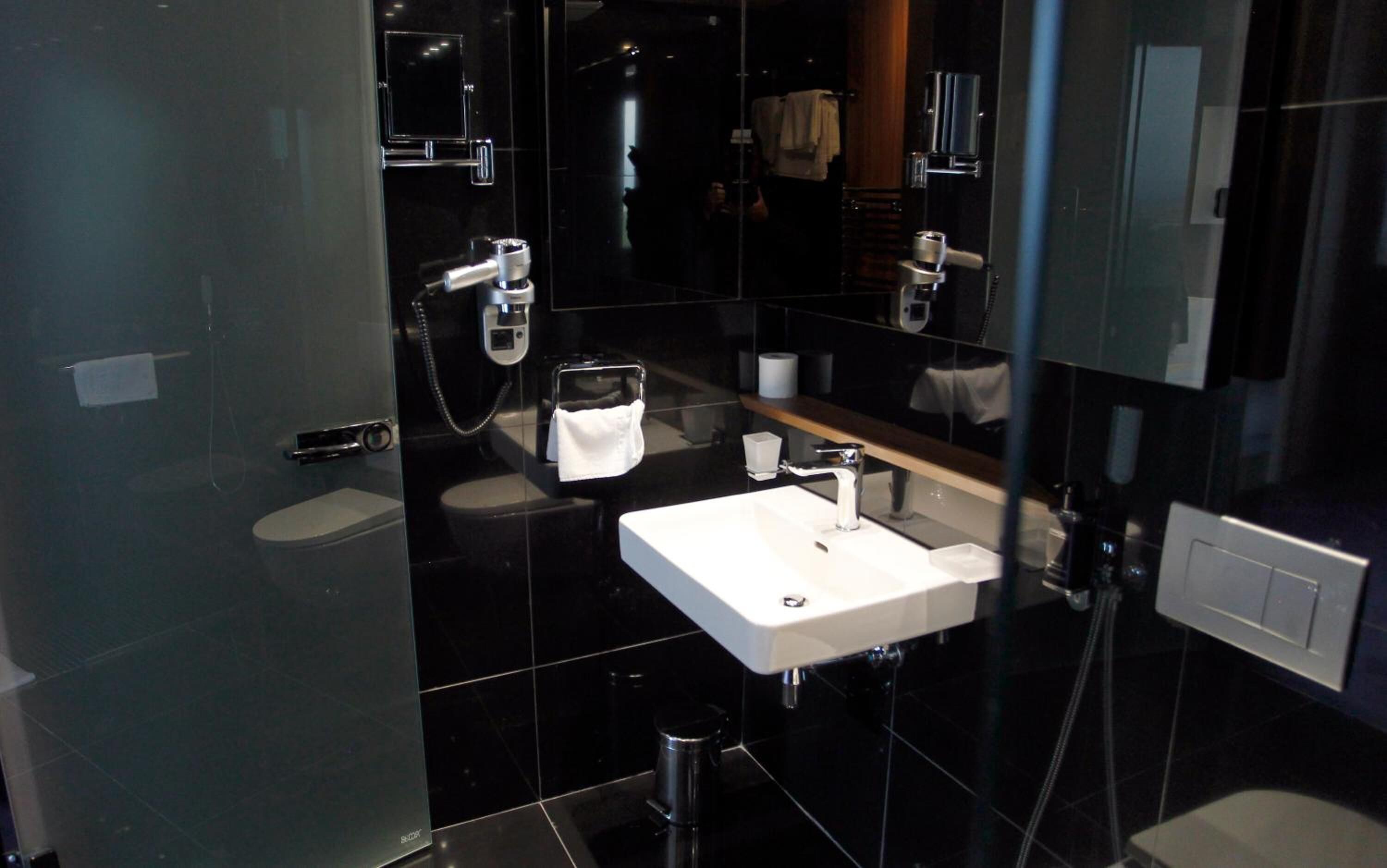 designer toiletries, hair dryer, bathrobes, slippers