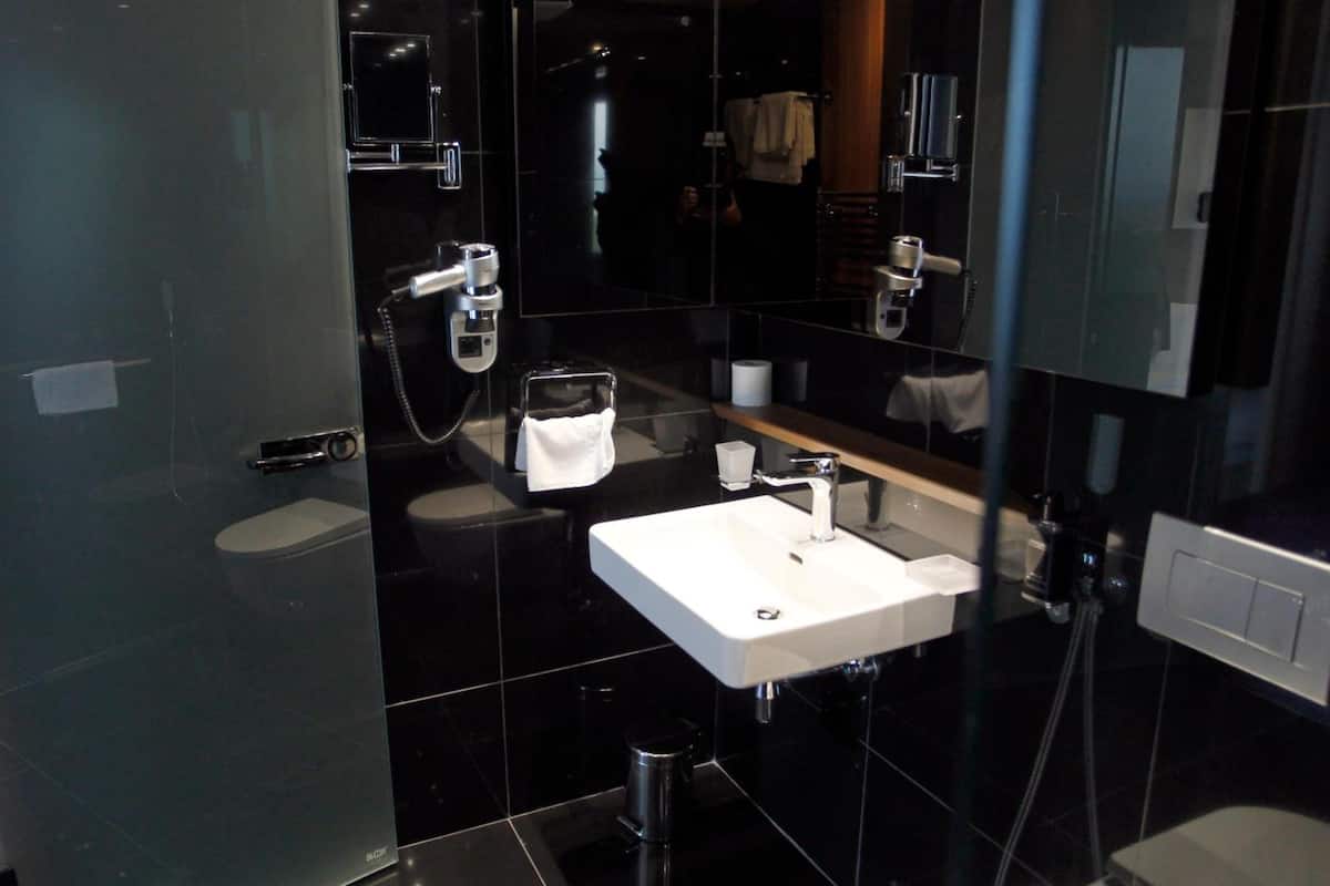 designer toiletries, hair dryer, bathrobes, slippers