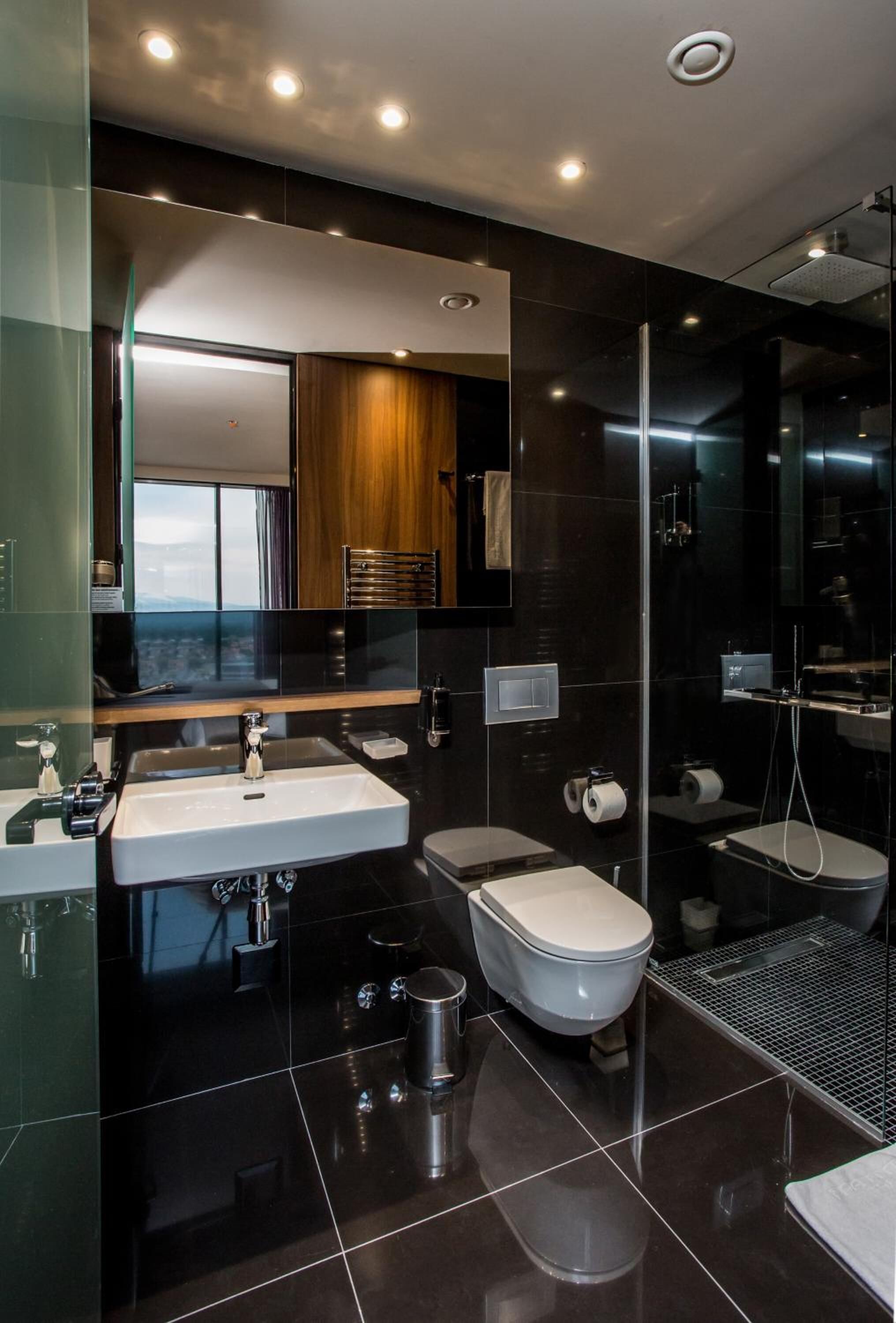 designer toiletries, hair dryer, bathrobes, slippers