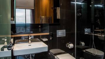 Designer toiletries, hair dryer, bathrobes, slippers