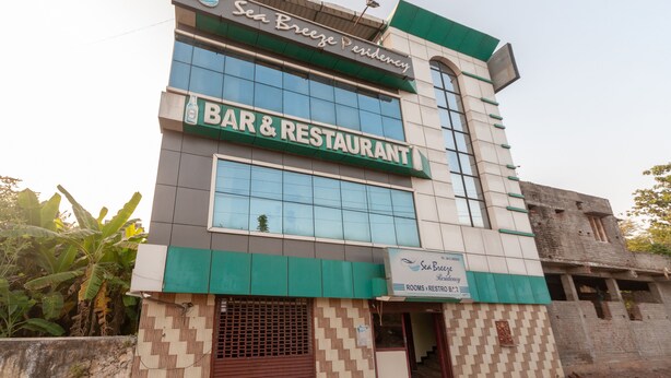 A building with a sign for "Sea Breeze Residency" and "BAR & RESTAURANT" on the facade. - OYO 23300 Seabreeze Residency (Puducherry)