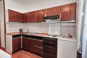 Apartment, Sea View | Private kitchen | Fridge, microwave, oven, stovetop
