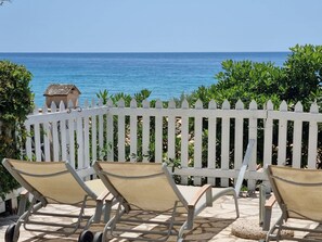 A patio with two chairs and a white picket fence overlooking the sea. - Corfu Island Apartment 22 (Corfu)