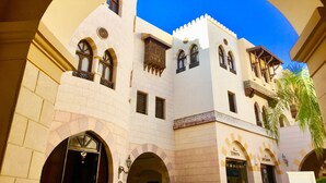 A traditional building with arched windows and a central courtyard. - Luxury villa with sea view and pool (Hurghada)