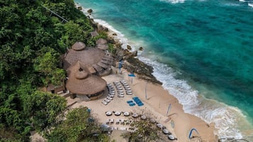 On the beach, sun-loungers, beach towels