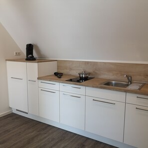 Apartment, 1 Bedroom | Private kitchenette | Fridge, stovetop, electric kettle, cookware/dishes/utensils