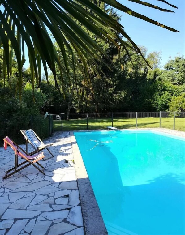 Seasonal outdoor pool, pool umbrellas, pool loungers