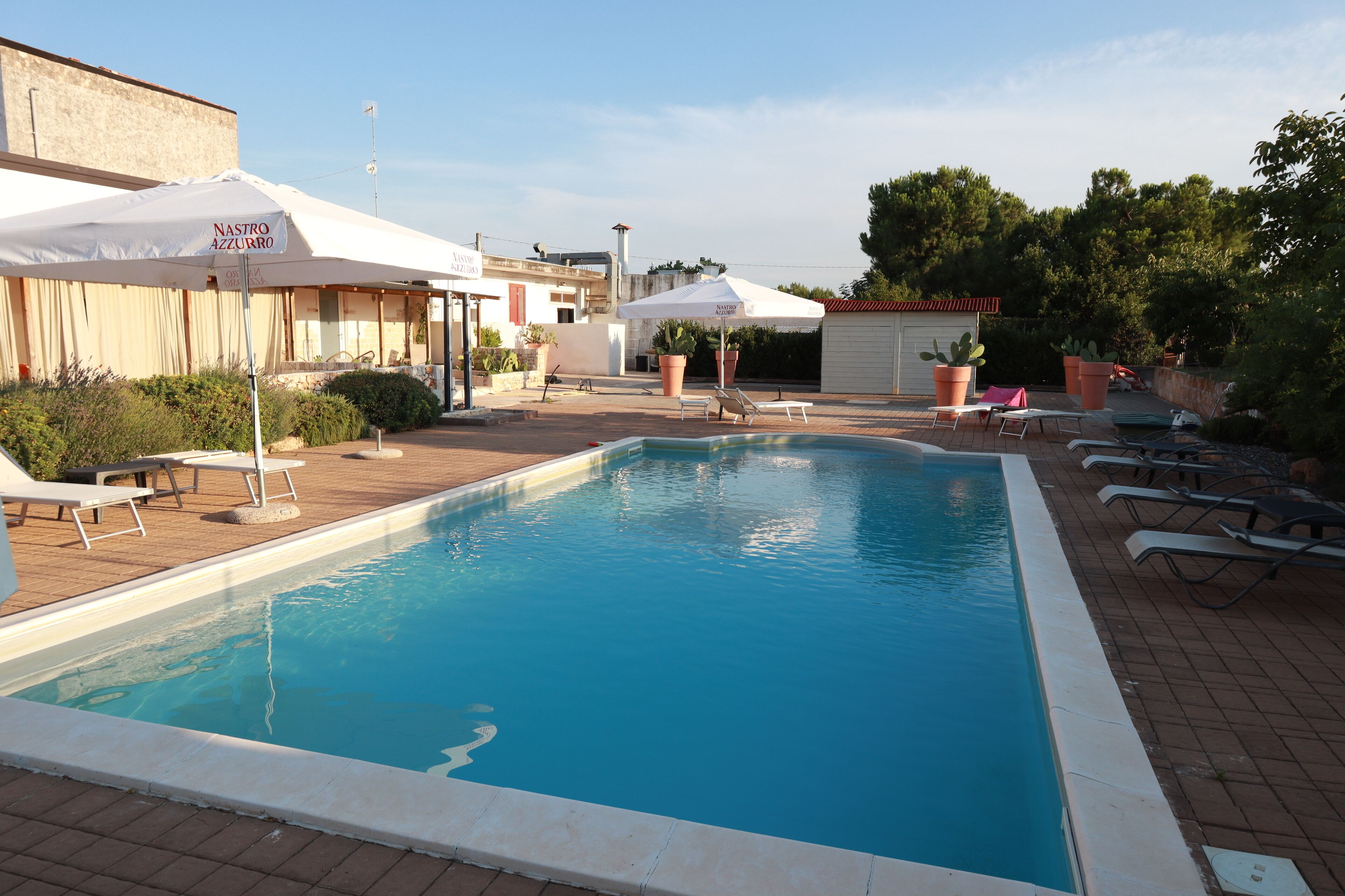 Seasonal outdoor pool, pool umbrellas, pool loungers