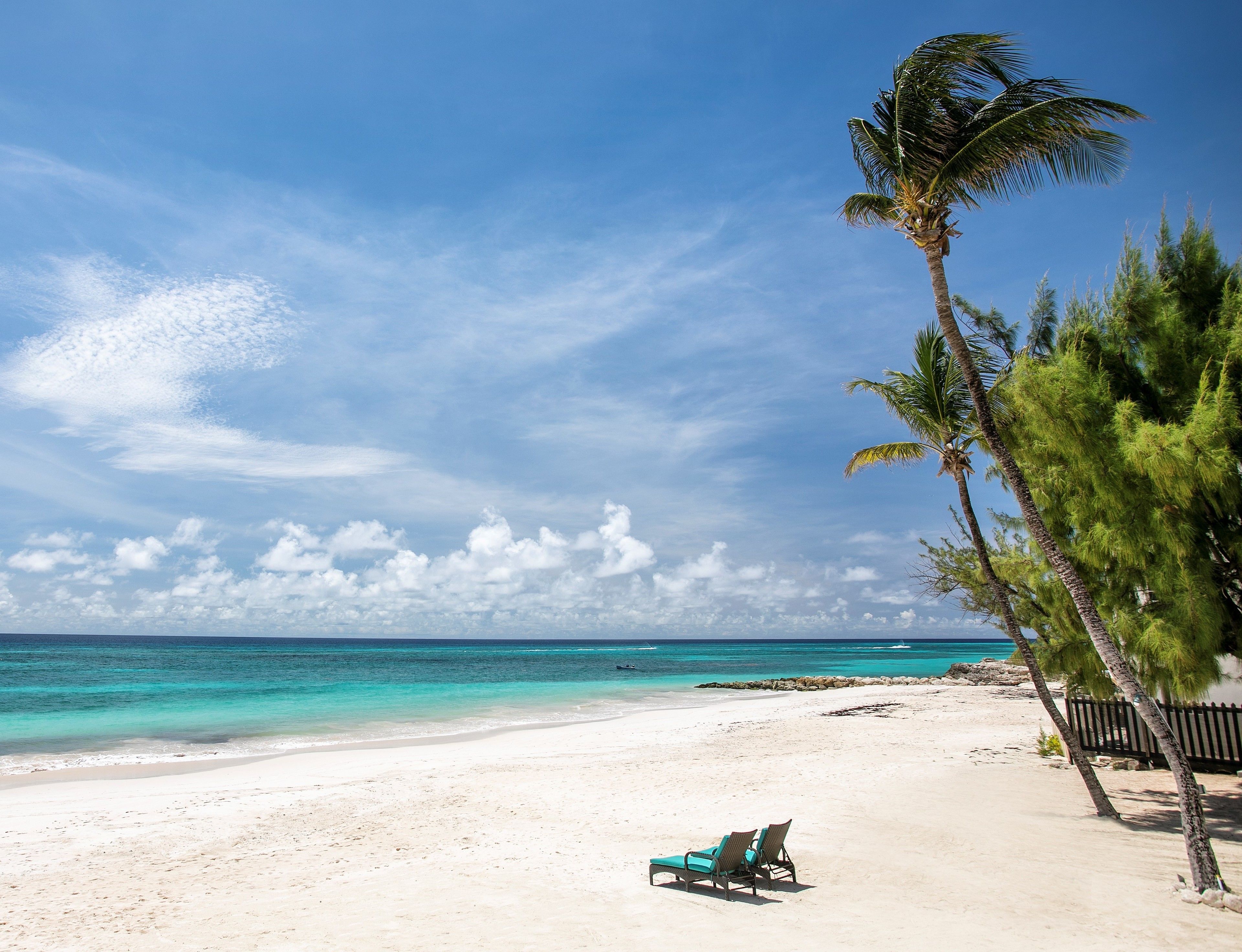 On the beach, white sand, sun-loungers, beach umbrellas