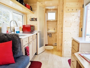 Relax in a cozy seating area with a sofa and enjoy a view of the surrounding area from the window.