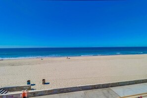 On the beach, sun loungers, beach umbrellas, beach towels