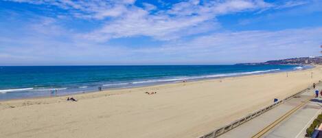 On the beach, sun loungers, beach umbrellas, beach towels