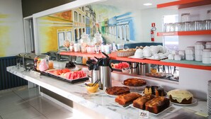 A buffet with various food items and beverages.