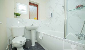 Combined shower/bathtub, hair dryer, towels, soap