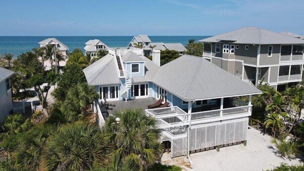 A coastal residential area with multiple houses, some with balconies and a view of the ocean. - Tailwind South: Beautiful 3 bedroom across the street from Beach! (Placida)