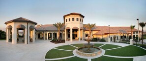 Stroll through the resort's serene courtyard, surrounded by lush greenery and a tranquil fountain.