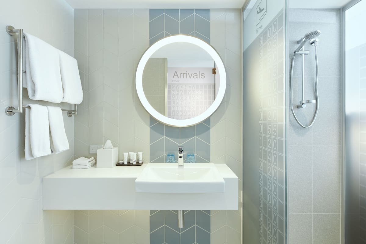 shower, designer toiletries, hair dryer, towels