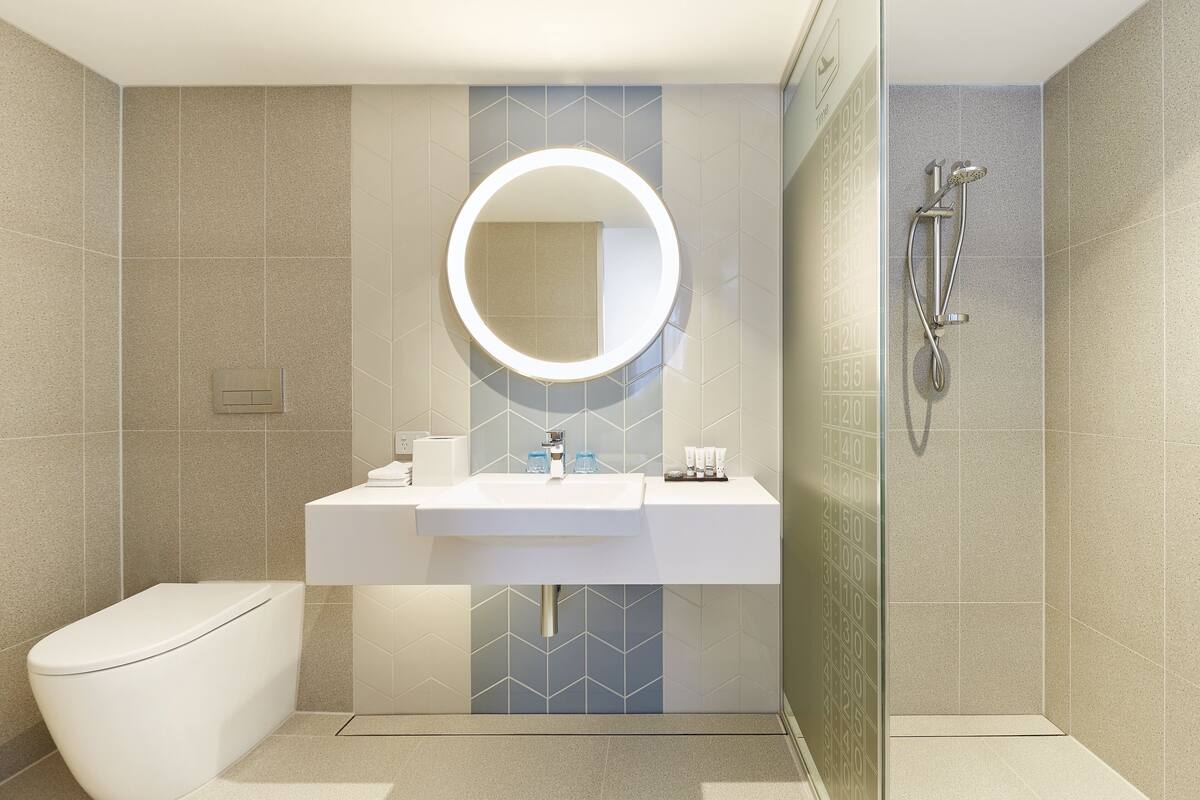 shower, designer toiletries, hair dryer, towels